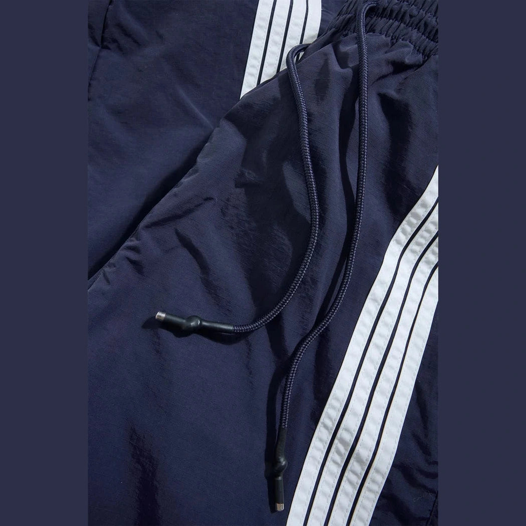 Jordan Craig Big Men’s The Beautiful Game navy track pants with white side stripes and drawstring waist