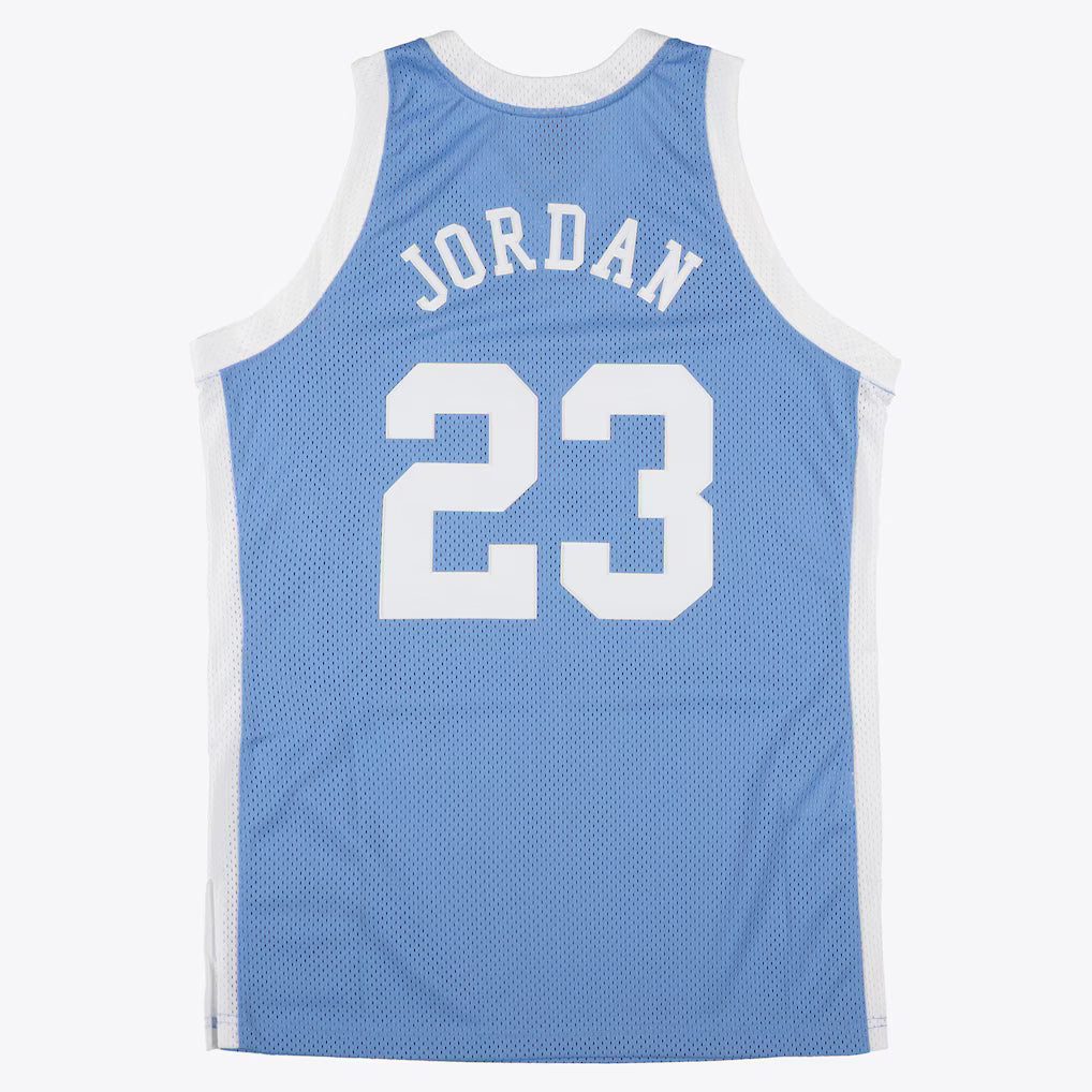 MITCHELL AND NESS NCAA BLUE NORTH CAROLINA TAR HEELS 1983 MICHAEL JORDAN JERSEY by Mitchell and Ness