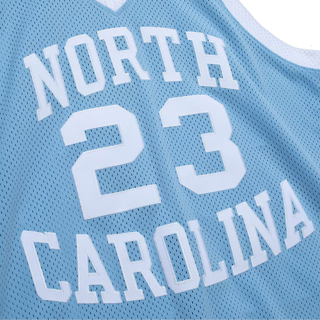 MITCHELL AND NESS NCAA BLUE NORTH CAROLINA TAR HEELS 1983 MICHAEL JORDAN JERSEY by Mitchell and Ness